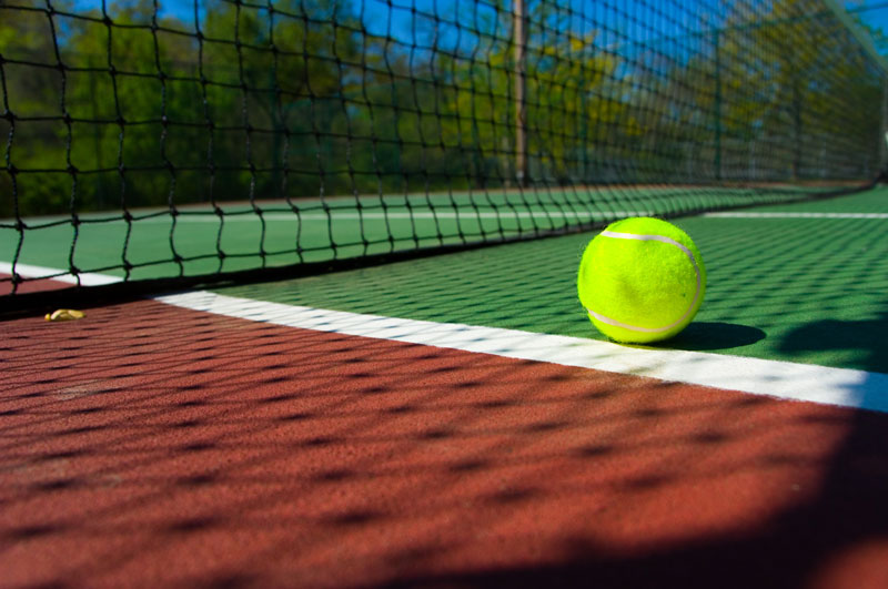 Picture of a Tennis Ball on Tennis Court
